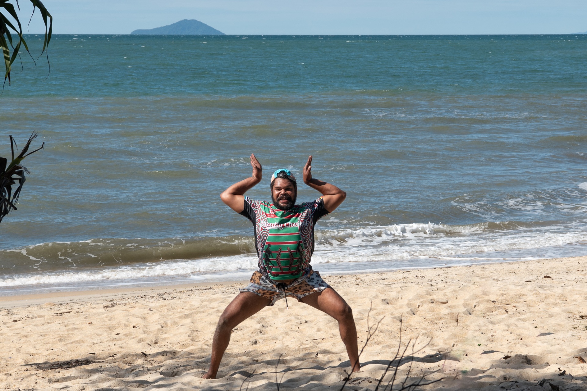 Brother striking a pose on the sand