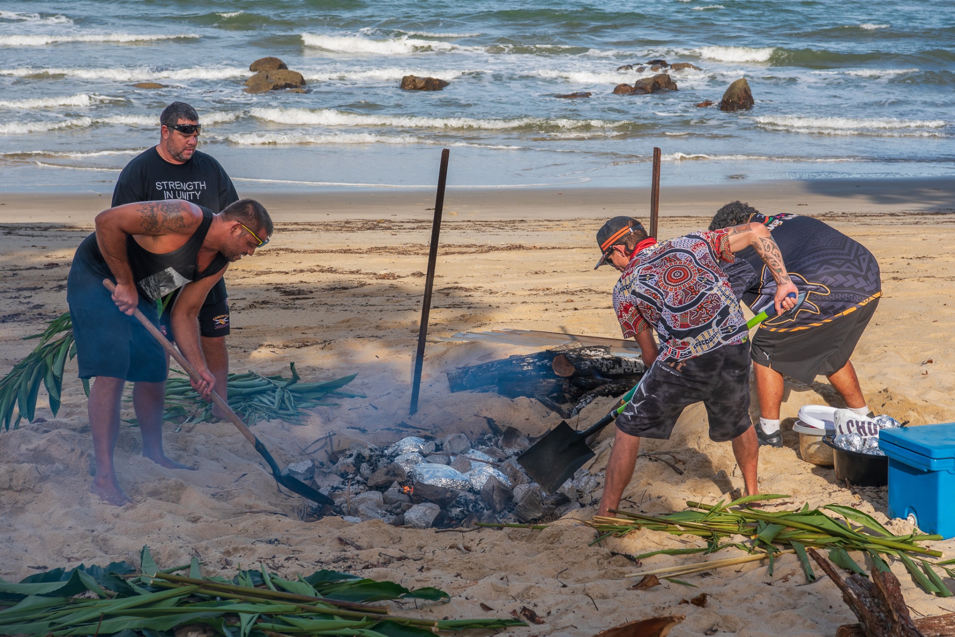 Kunjur brothers cooking on the beach