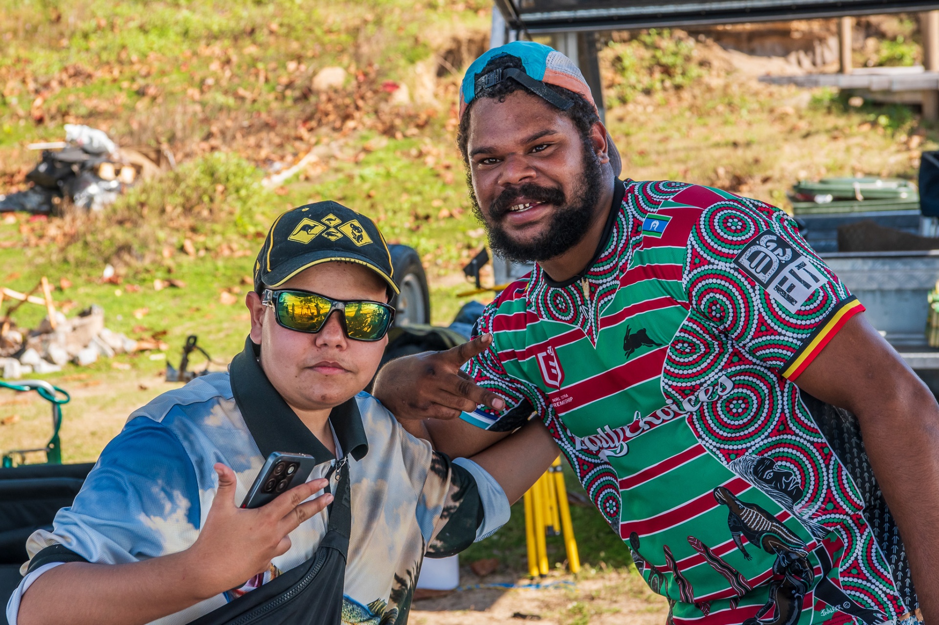 Two Kunjur brothers laughing together at a community gathering