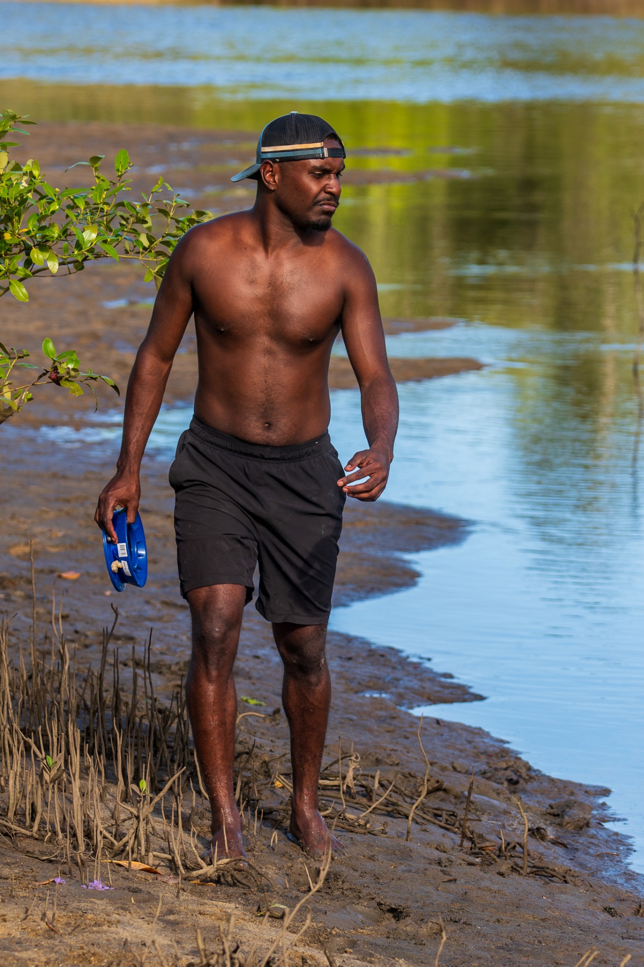 A brother walking quietly along the river bank
